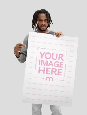 A1 Paper Mockup Held by a Black Guy Pointing to the Paper