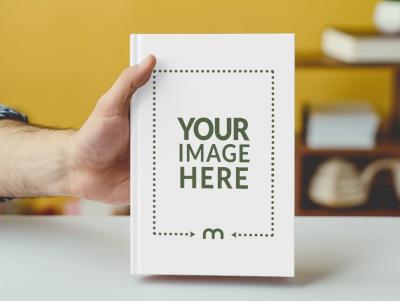 Book Cover Mockup Held By Writer in A Hand