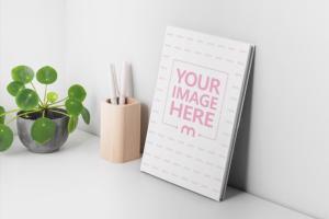 Hardcover Book Leaning on a Wall Mockup Generator