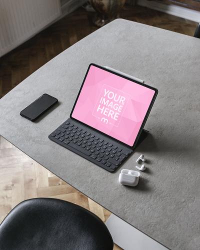 iPad Mockup With Airpods and iPhone on Desk