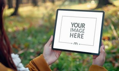 iPad Screen Mockup Held By Woman Outside