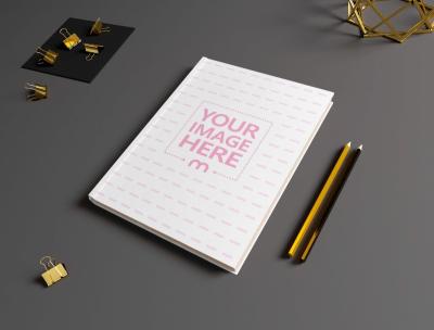 Journal Mockup on the Top of a Black Table Around the Stationery Items