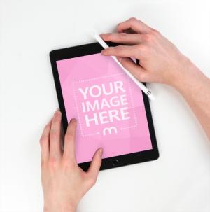 Man Using iPad Mini with Apple Pencil Mockup Generator