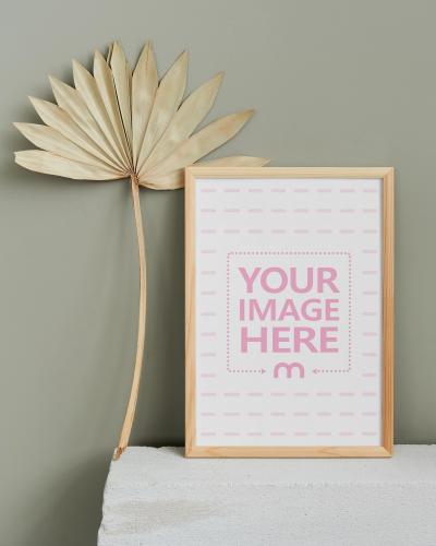 Picture Frame with Leaf on Grey Background Mockup