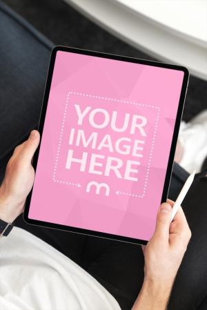 Free Portrait iPad in Hand Mockup