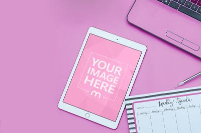 White iPad on Pink Office Desk Scene Mockup Generator
