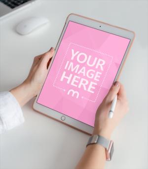 Woman Holding White iPad in Portrait Mode Mockup Generator